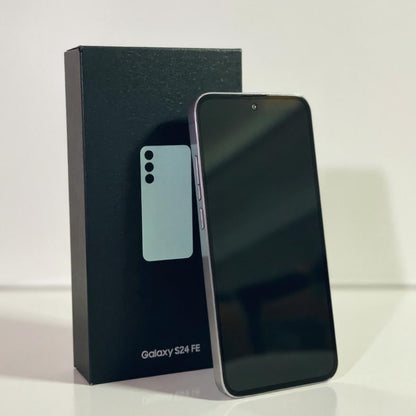 Samsung Galaxy S24 FE smartphone next to its packaging on a white background