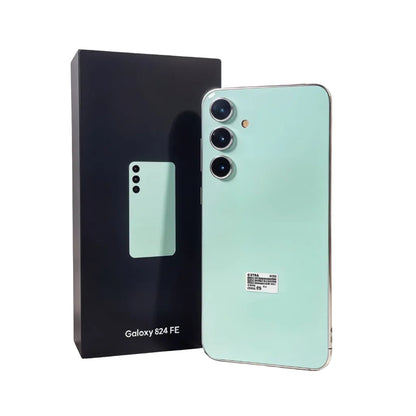 Mint green smartphone next to its packaging on a white background